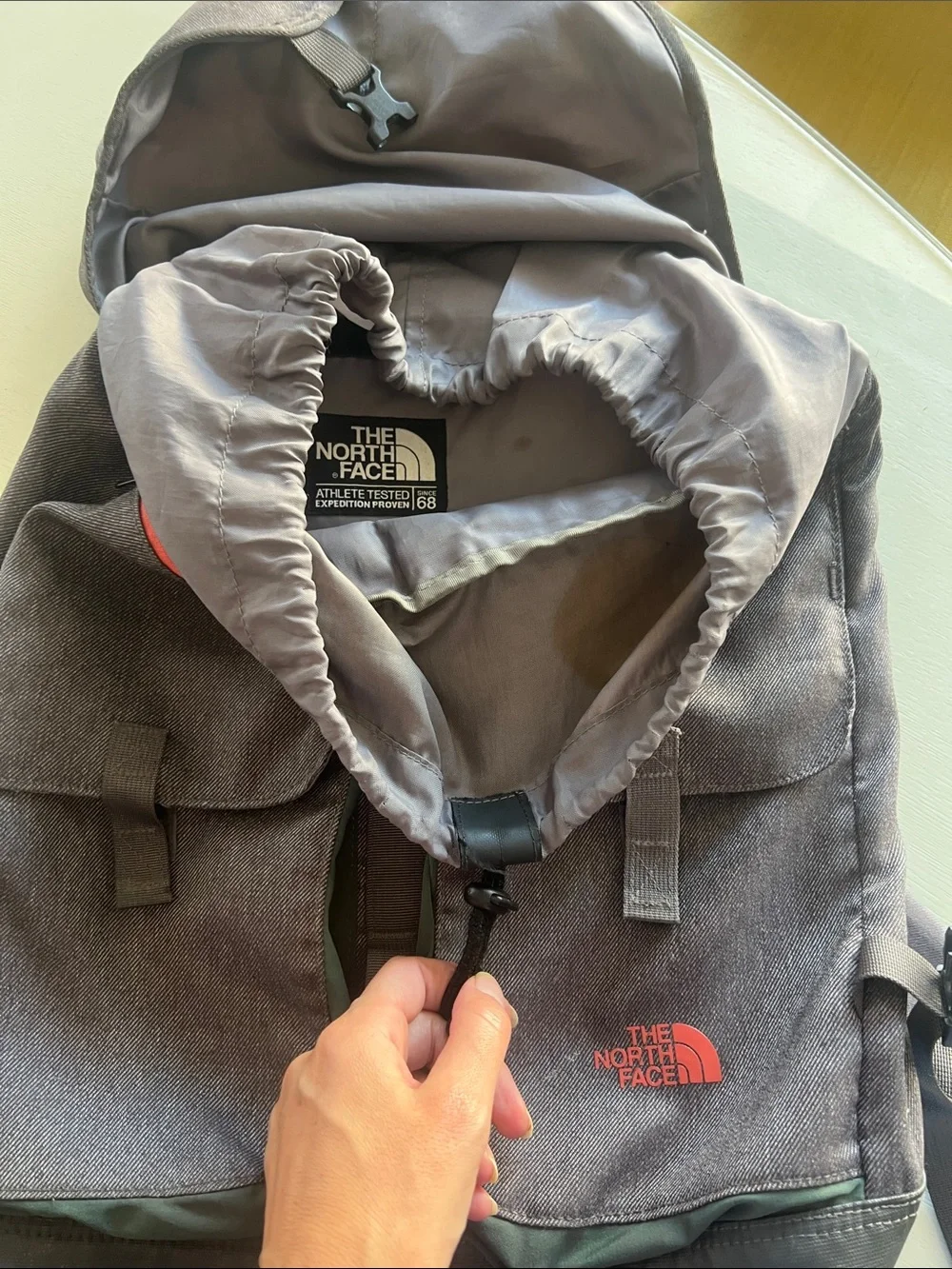 The North Face Gray Backpack with Red Logo and Black Base